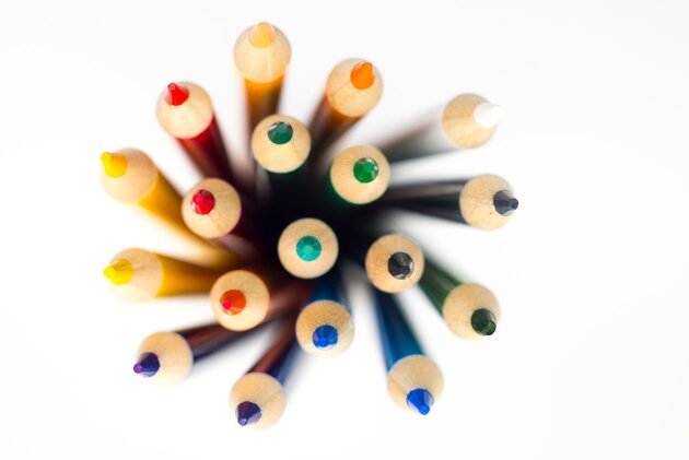 Coloured pencils seen from above, the tools of brand and graphic design