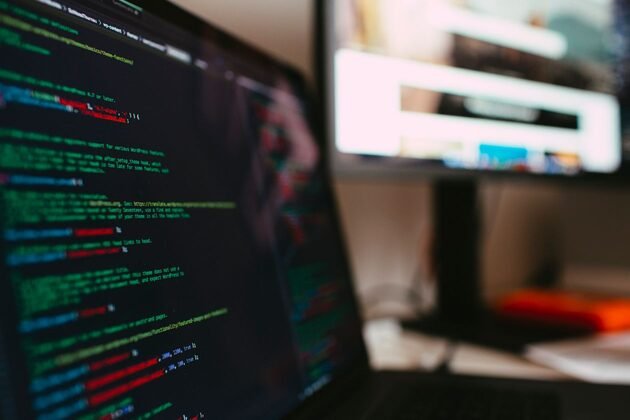 Laptop screen showing website code during development